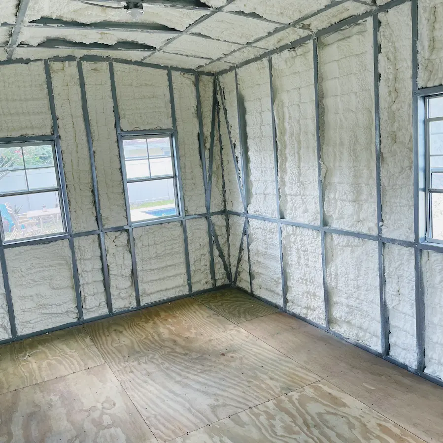 Closed-cell spray foam insulation applied to wall cavities in a residential project in Whitehall